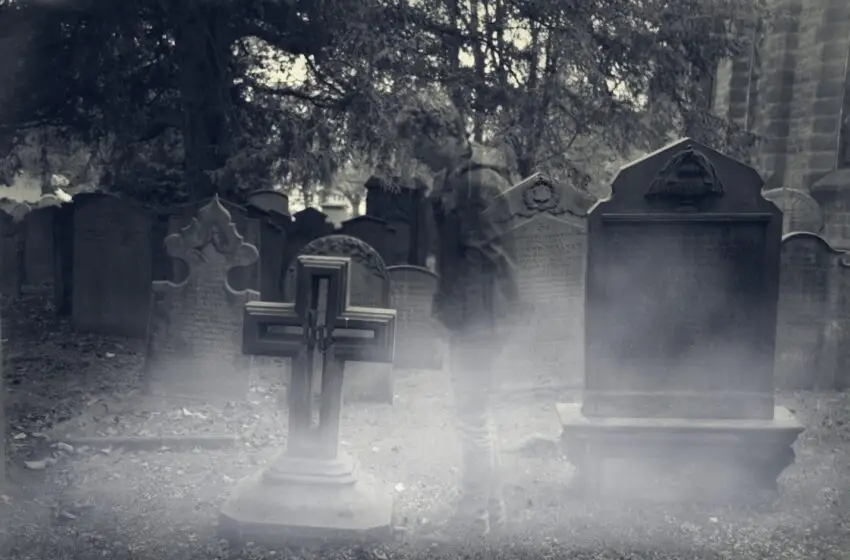Male teenager ghost in grave yard